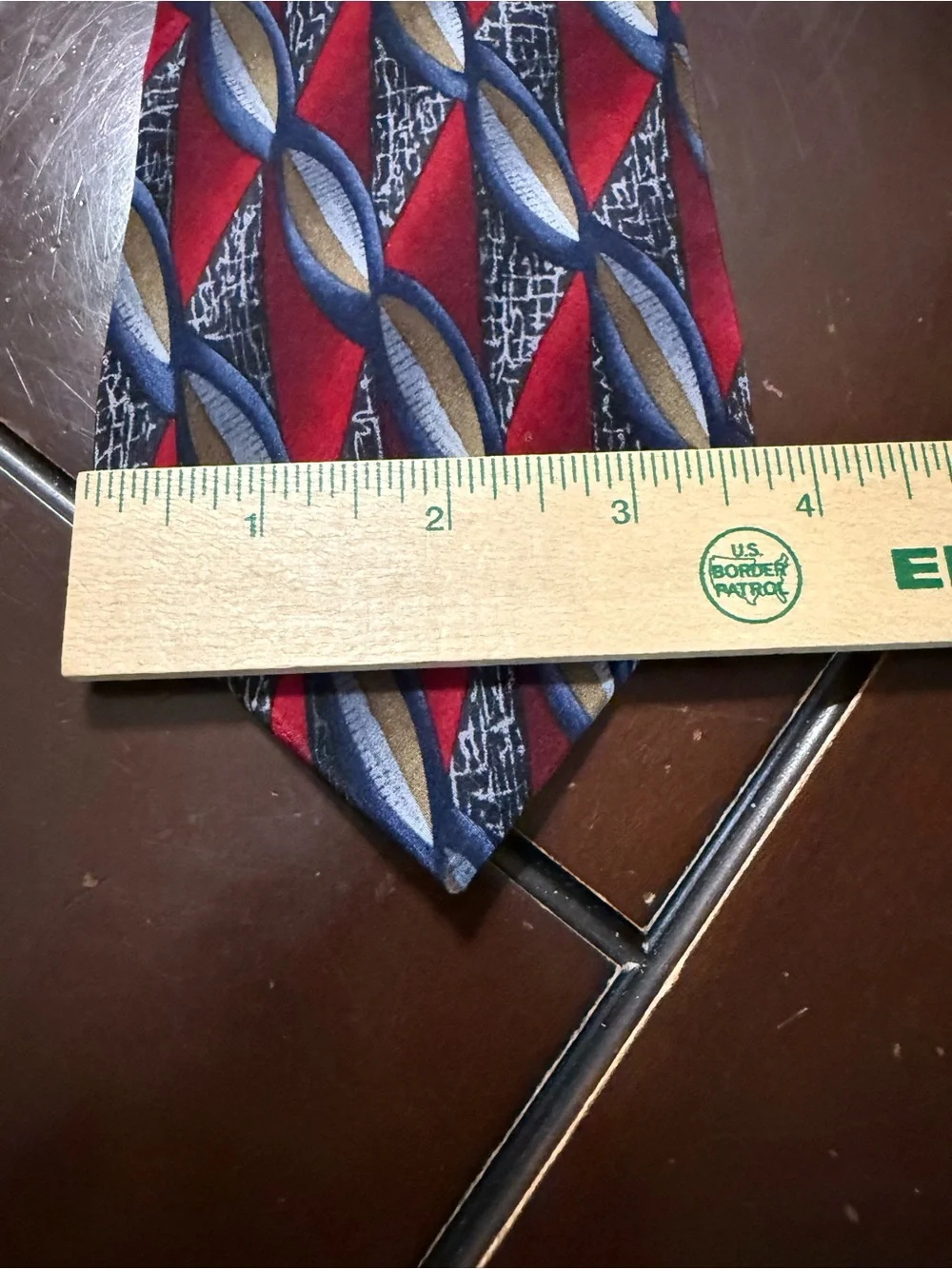 Men's Red Geometric Pattern Tie with Blue and Gold Accents